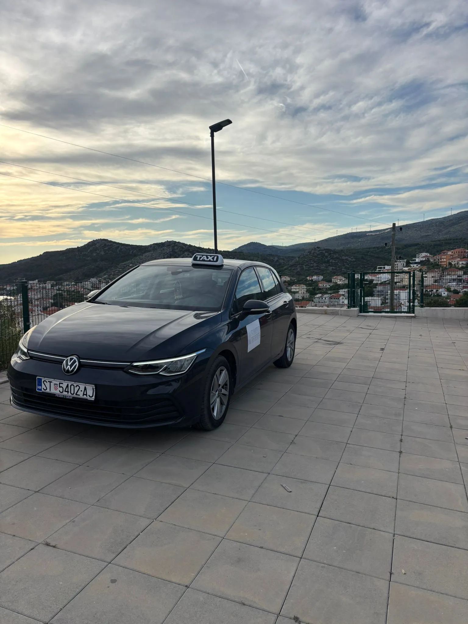Taxi Mediteraneo Volkswagen Golf 8 taxi, side view in Dalmatia